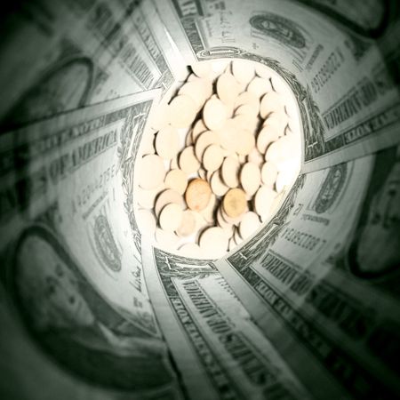 dollar tube look at money coinsの写真素材