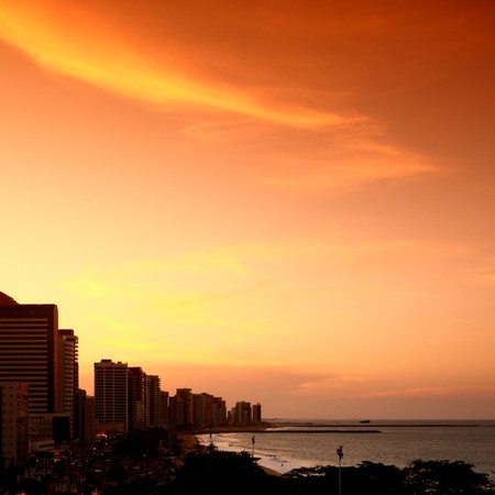 city sunset on ocean waterの写真素材