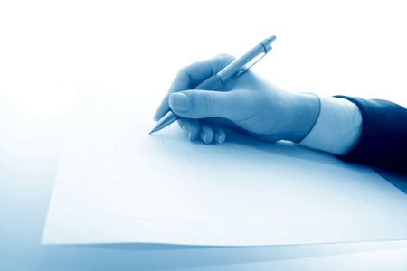 girl write on white paper close upの写真素材