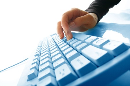 girl hands typing on keyboard macro close upの写真素材