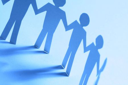 paper team linked together partnership concept
