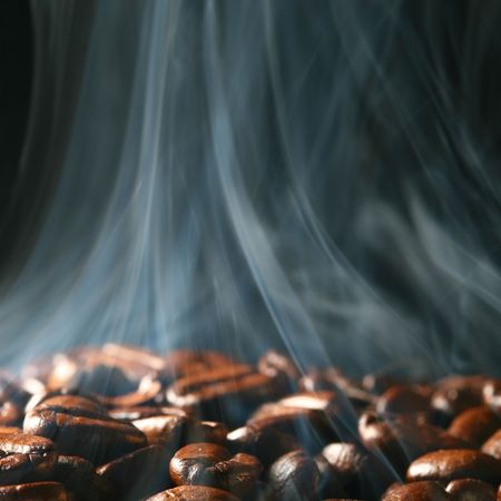 macro coffee beans in aroma smokeの写真素材