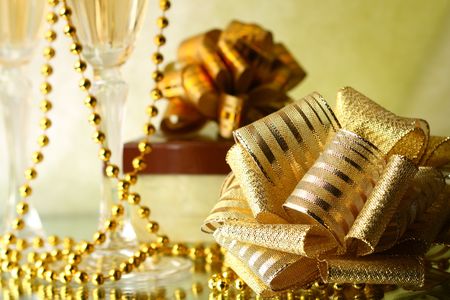 holiday card golden champagne and giftの写真素材