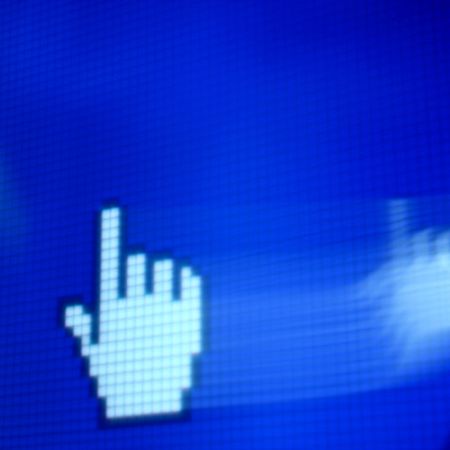 finger corsor on blue pixel screenの写真素材