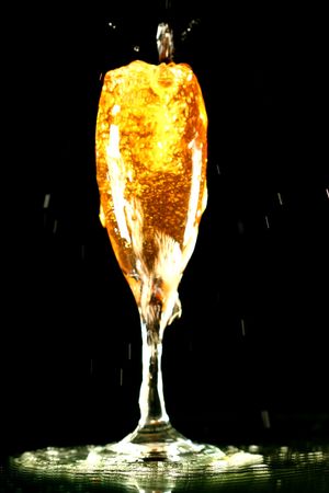 champagne in glass on black backgroundの写真素材