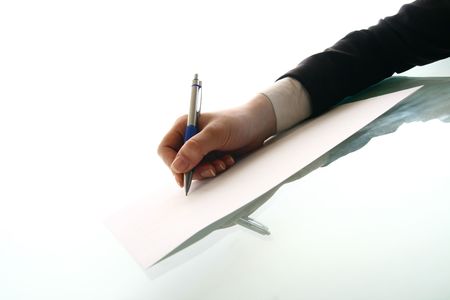 girl write on white paper close upの写真素材