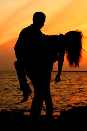 relax on gold sunset  romance flirt of two person on vacationの写真素材