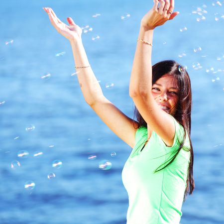 woman relax blue sea and bubbles on backgroundの写真素材