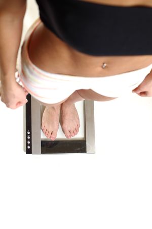 legs on scales isolated on white backgroundの写真素材