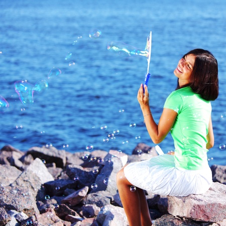 woman relax blue sea and bubbles on background