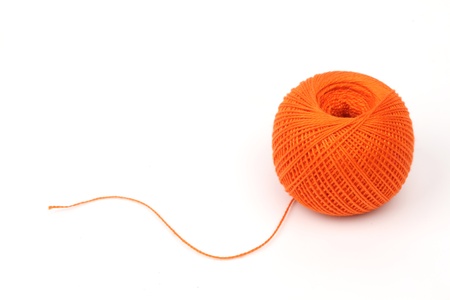 thread on blue silk background close upの写真素材