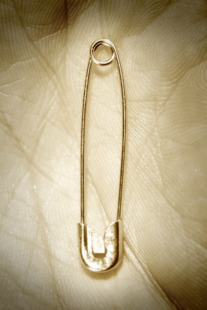 iron Pin in man hand close upの写真素材