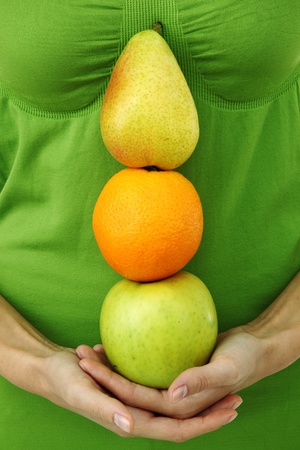 fruit pile in woman hands on whiteの写真素材