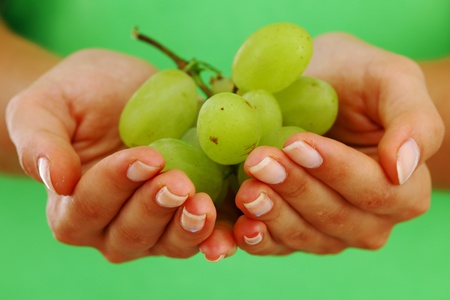 grape in woman hands close upの写真素材