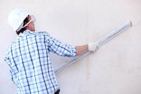 worker aligns wall for directingの写真素材