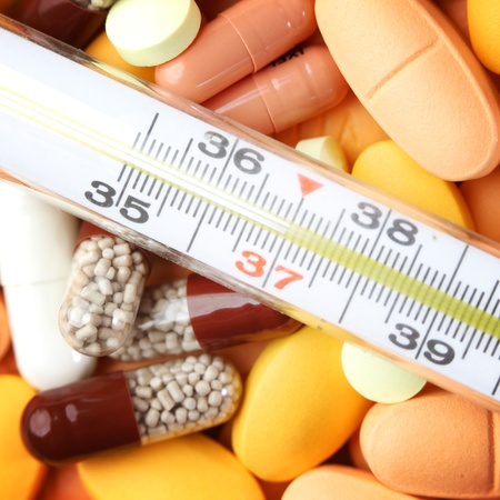 thermometer and drugs medical background
