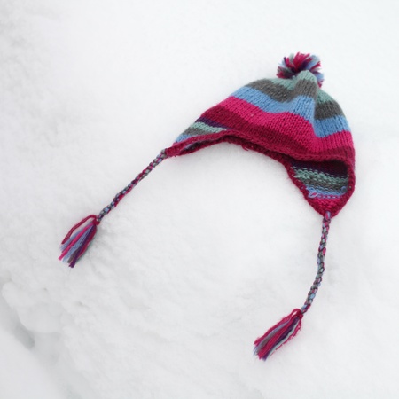 hat on snow close upの写真素材