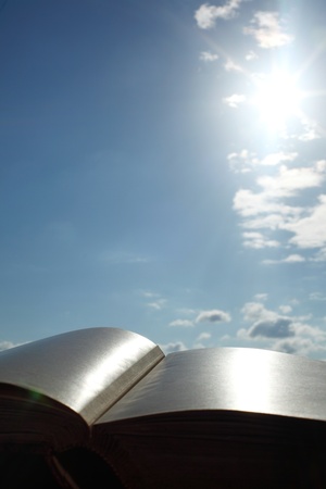  book of wisdom on sun sky backgroundの写真素材