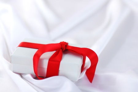  christmas gift on white silk backgroundの写真素材