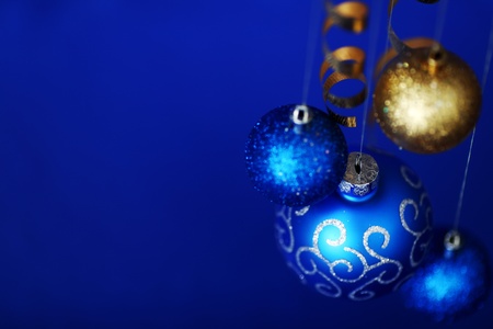christmas balls on blue satin backgroundの写真素材