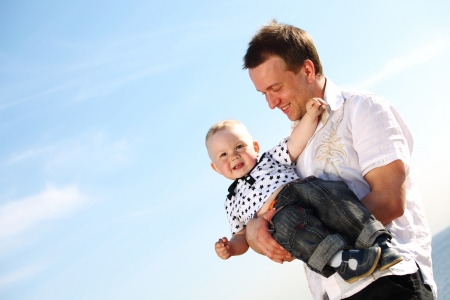 father and son in blue skyの写真素材