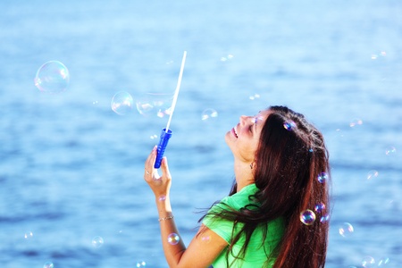 woman relax blue sea and bubbles on backgroundの写真素材