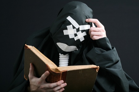 black mime reading a bookの写真素材