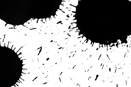 black grunge ink splash on white paperの写真素材