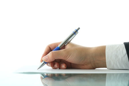 girl write on white paper close upの写真素材