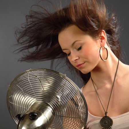 girl with fan studio portraitの写真素材