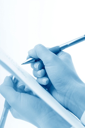 girl write on white paper close upの写真素材