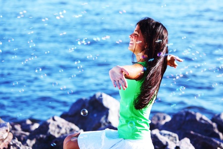 woman relax blue sea and bubbles on backgroundの写真素材