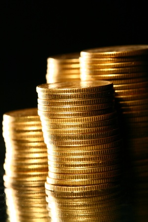 golden piles of coins macro backgroundの写真素材