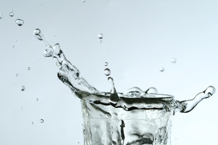 super splash in glass on white backgroundの写真素材