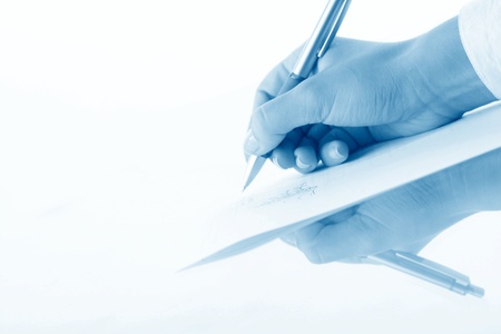 girl write on white paper close upの写真素材