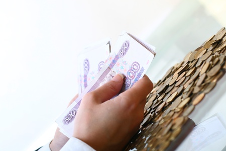 hands hold russian rouble money on white background