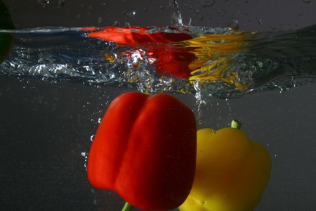 paprica splash in water isolated on white backgroundの写真素材