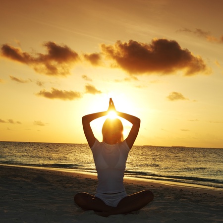 sunset yoga woman on sea coast sunset yoga woman on sea coast