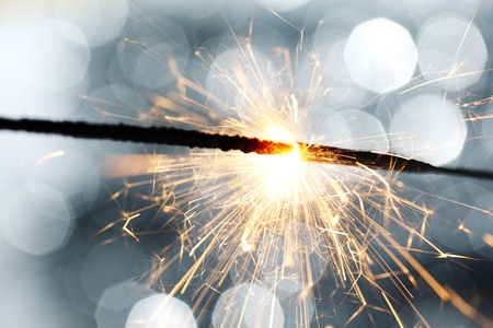 sparkler on silver bokeh background macro close upの写真素材