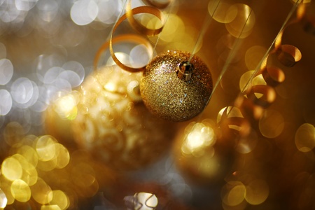 golden christmas balls on bokeh backgroundの写真素材