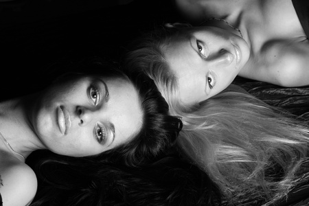 blond and brunette head to head on Floorの写真素材