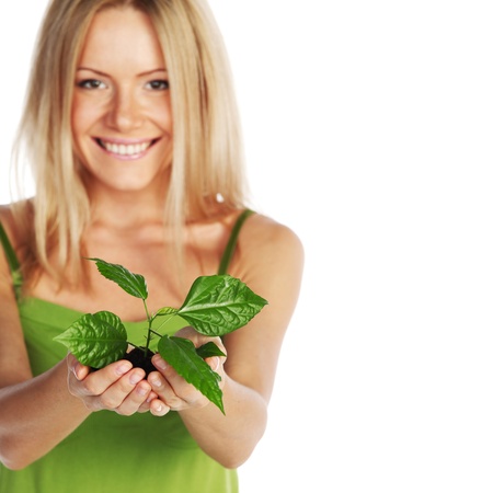 plant in blonde hands close upの写真素材