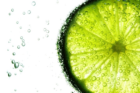 lime slice in water bubblesの写真素材