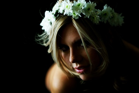 young women on black flowers in hairの写真素材