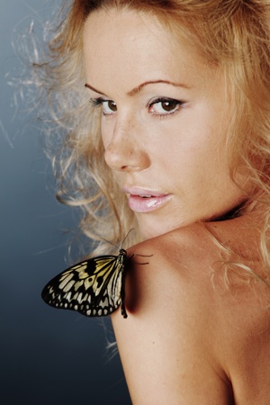 woman and butterfly on blackの写真素材