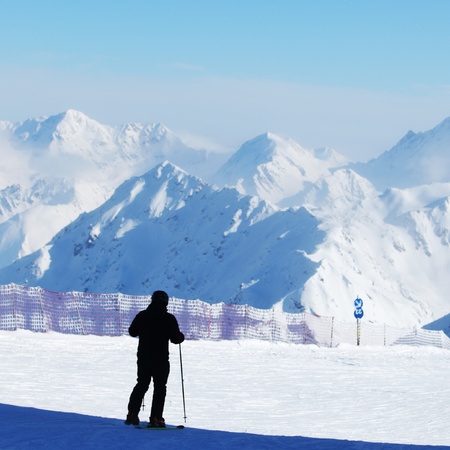 skiers on the mountain backdropの写真素材