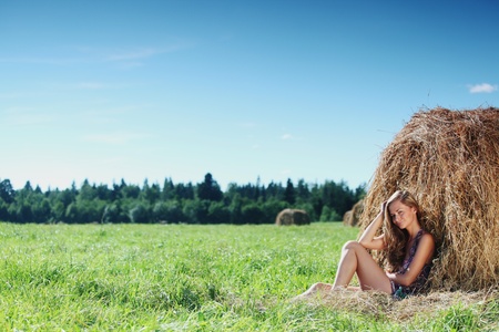 woman on hay nature backgroundの写真素材