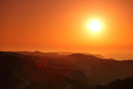 Summer landscape in mountains with the sunの写真素材