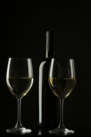 white wine glass silhouette black backgroundの写真素材