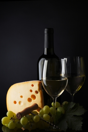 white wine and cheese on blackの写真素材